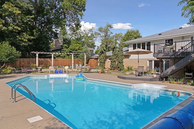 view of swimming pool featuring stairs, a fenced in pool, a patio area, and fence