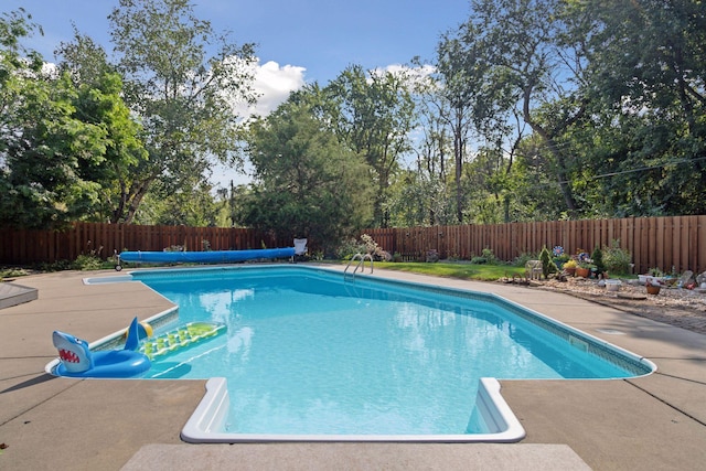 view of pool with a fenced in pool, a patio, and a fenced backyard