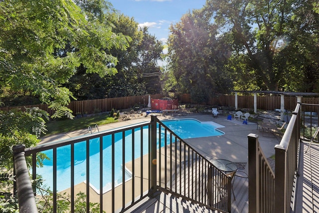 view of pool with a patio, a fenced backyard, and a fenced in pool