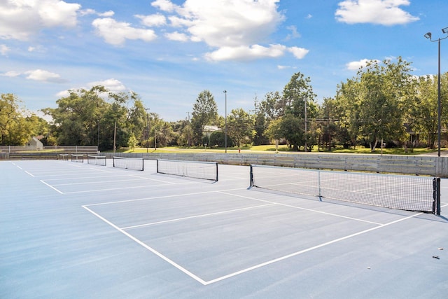 view of tennis court with fence