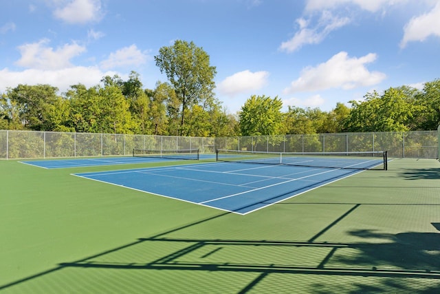 view of sport court with fence