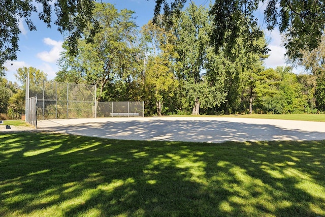 exterior space featuring a lawn and fence