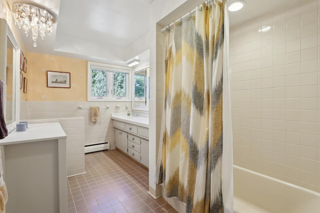 bathroom featuring vanity, shower / tub combo, a baseboard heating unit, tile walls, and tile patterned floors