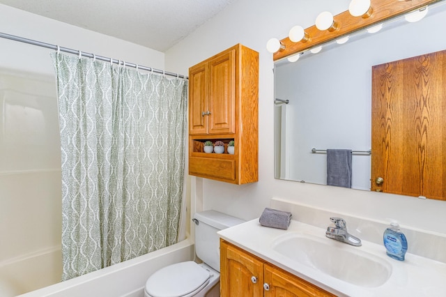 bathroom featuring vanity, toilet, shower / bathtub combination with curtain, and a textured ceiling