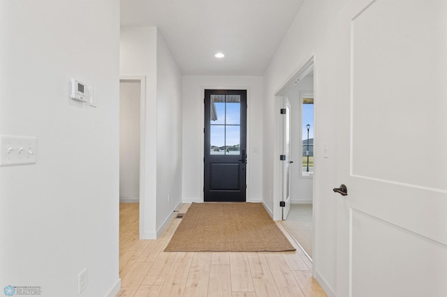 doorway with light hardwood / wood-style flooring