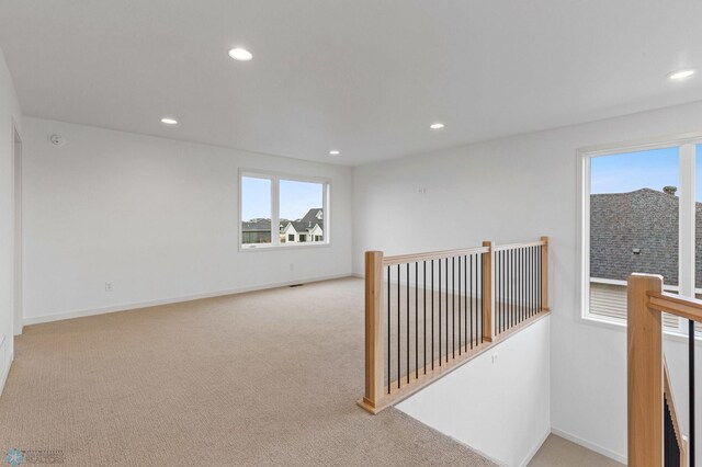 hallway with light carpet