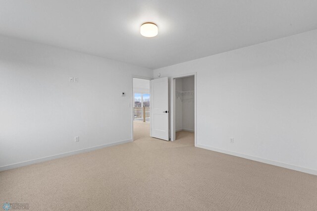 empty room with light colored carpet