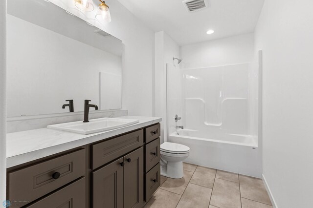 full bathroom with tile patterned flooring, vanity, toilet, and tub / shower combination