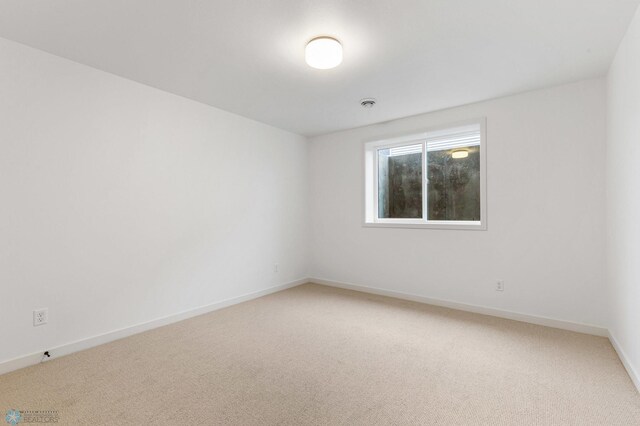 spare room featuring carpet flooring