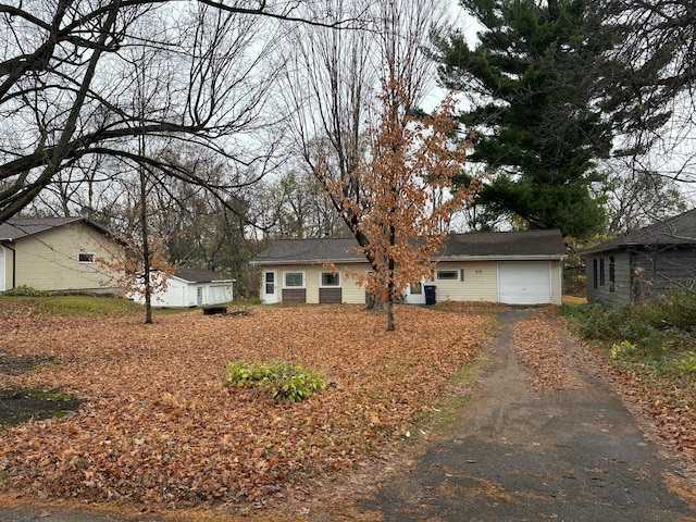 ranch-style house with an outdoor structure