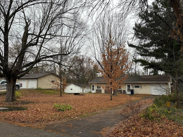 ranch-style home featuring a garage