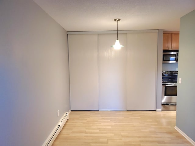 4110 Rahn Rd Unit 215, Eagan, MN 55122 - unfurnished dining area with light wood finished floors and baseboards