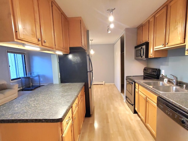 kitchen featuring sink, stainless steel appliances, a baseboard radiator, light hardwood / wood-style floors, and decorative light fixtures