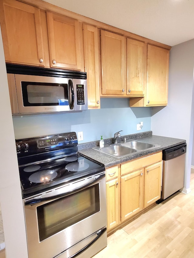 4110 Rahn Rd Unit 215, Eagan, MN 55122 - kitchen with stainless steel appliances, dark countertops, and light wood-style floors