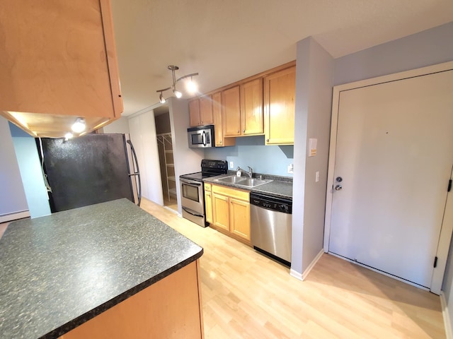 4110 Rahn Rd Unit 215, Eagan, MN 55122 - kitchen featuring appliances with stainless steel finishes, light wood-style floors, dark countertops, light brown cabinets, and a baseboard heating unit