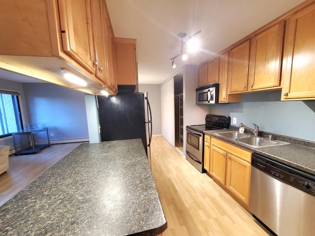 4110 Rahn Rd Unit 215, Eagan, MN 55122 - kitchen with stainless steel appliances, dark countertops, light wood-style flooring, and rail lighting