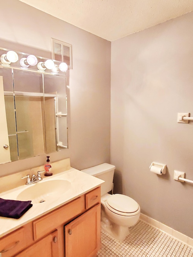 4110 Rahn Rd Unit 215, Eagan, MN 55122 - bathroom with vanity, toilet, visible vents, a textured ceiling, and a shower with door