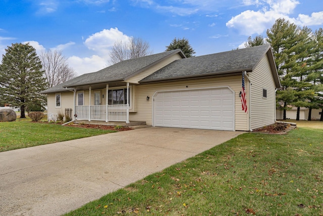 ranch-style house featuring covered porch, a front yard, and a garage