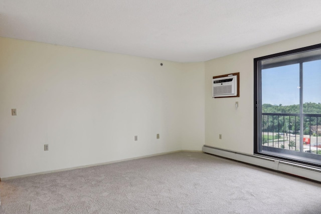 carpeted empty room with an AC wall unit, plenty of natural light, and baseboard heating