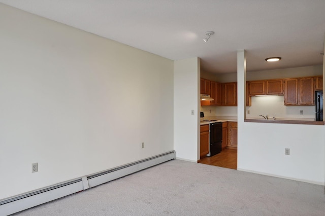 kitchen with light carpet, sink, black appliances, and a baseboard radiator