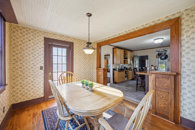 dining area with dark hardwood / wood-style floors