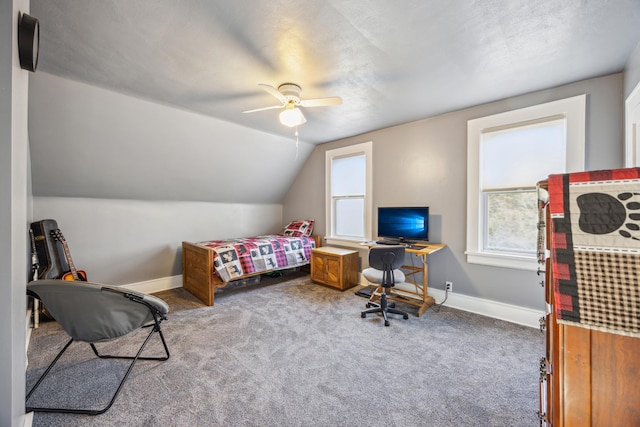 carpeted bedroom with multiple windows, a textured ceiling, vaulted ceiling, and ceiling fan