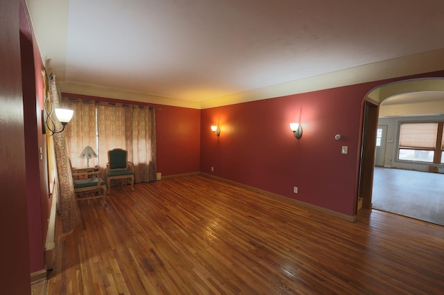 spare room with dark hardwood / wood-style floors