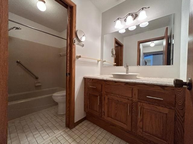 full bathroom with tile patterned floors, vanity, a textured ceiling, shower / tub combination, and toilet