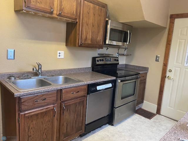 kitchen featuring appliances with stainless steel finishes and sink