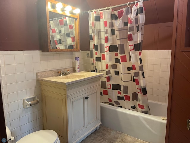 full bathroom featuring shower / bath combination with curtain, vanity, toilet, and tile walls