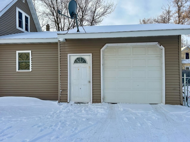 view of snow covered garage