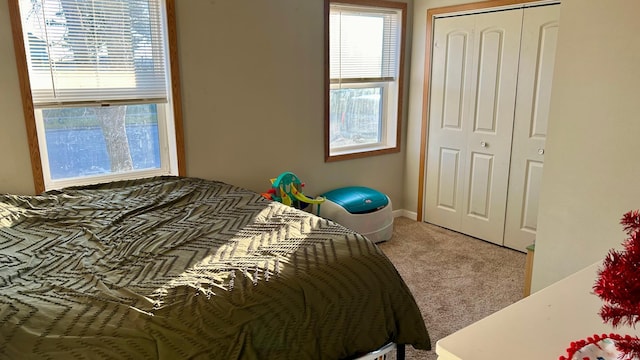 carpeted bedroom featuring a closet