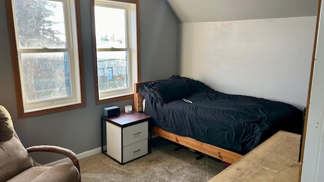 carpeted bedroom featuring lofted ceiling