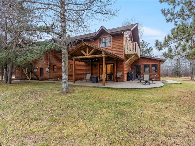 back of house with a patio area and a lawn