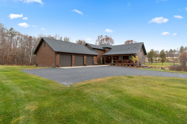 view of front facade with a front lawn and a garage