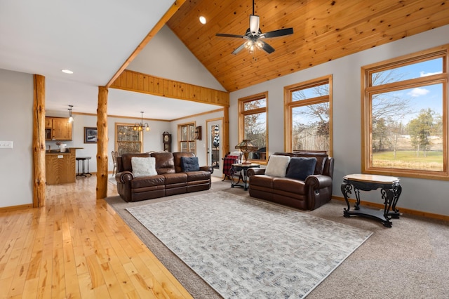 living room with ceiling fan with notable chandelier, wood ceiling, high vaulted ceiling, and light hardwood / wood-style flooring