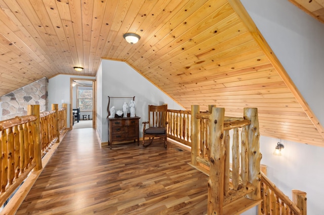 interior space featuring dark hardwood / wood-style flooring, wood ceiling, and lofted ceiling