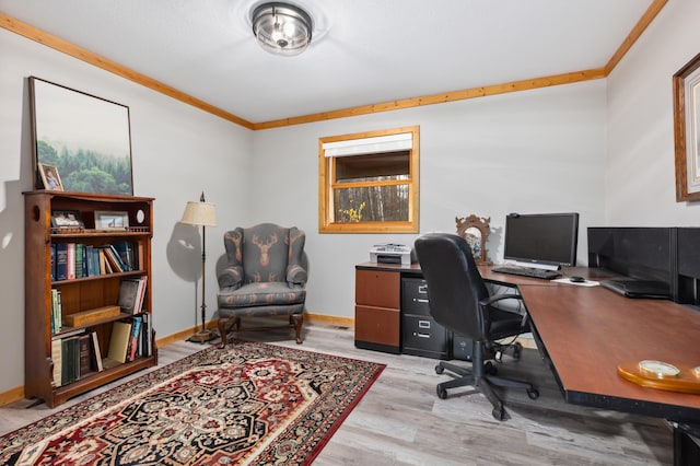 office with light hardwood / wood-style flooring and ornamental molding