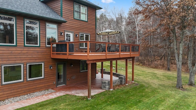 back of house featuring a patio area, a yard, and a wooden deck