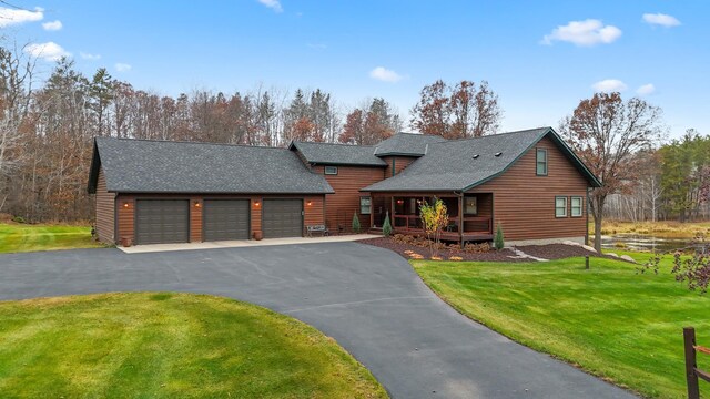 view of front facade with a garage and a front lawn