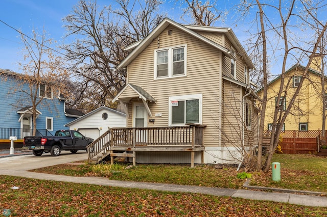 view of front facade featuring an outbuilding and a garage