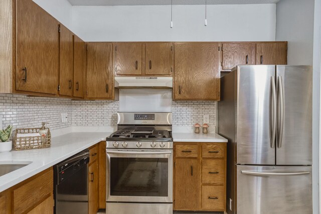 7037 110th Street Cir Unit 14, Bloomington, MN 55438 - kitchen with appliances with stainless steel finishes, under cabinet range hood, light countertops, and backsplash