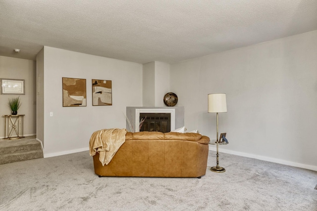 7037 110th Street Cir Unit 14, Bloomington, MN 55438 - living area with carpet, a glass covered fireplace, baseboards, and a textured ceiling