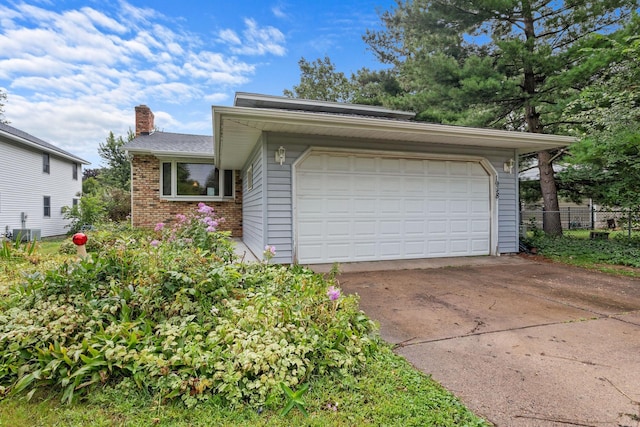 view of front of property with fence, central AC unit, brick siding, and a chimney