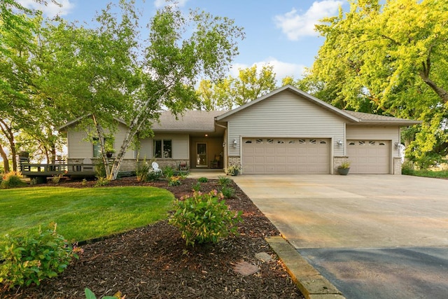 ranch-style home with a garage and a front yard