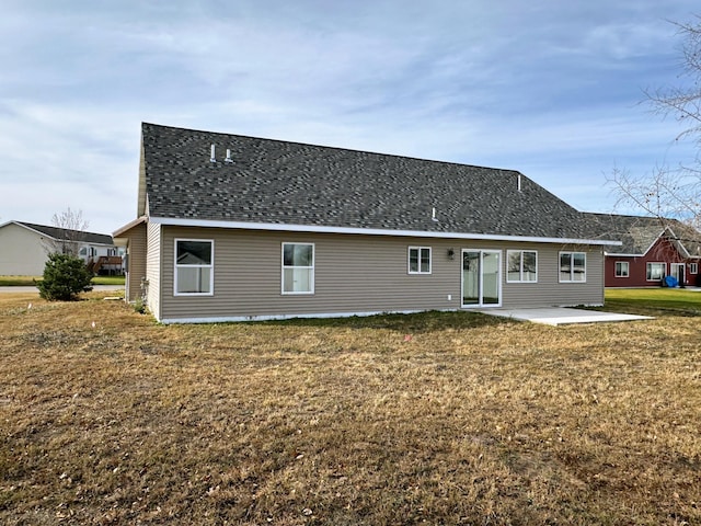 rear view of house with a patio area and a yard