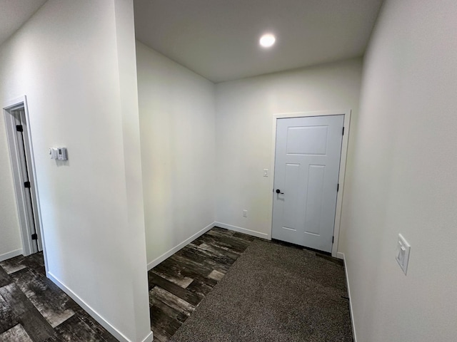 corridor featuring dark hardwood / wood-style floors