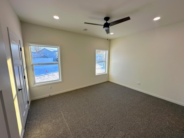 carpeted empty room featuring ceiling fan