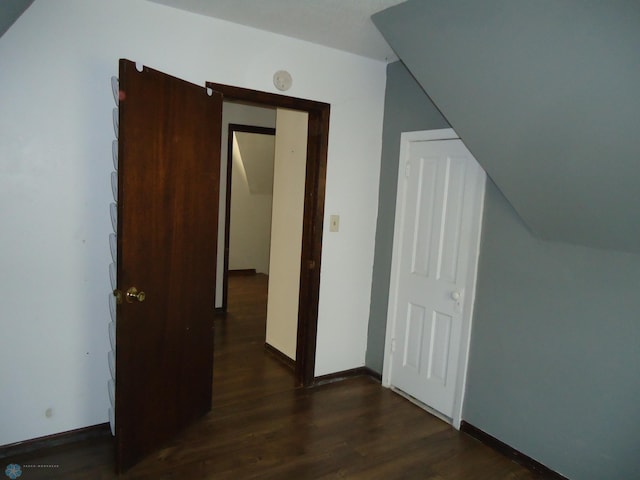 bonus room with dark hardwood / wood-style flooring