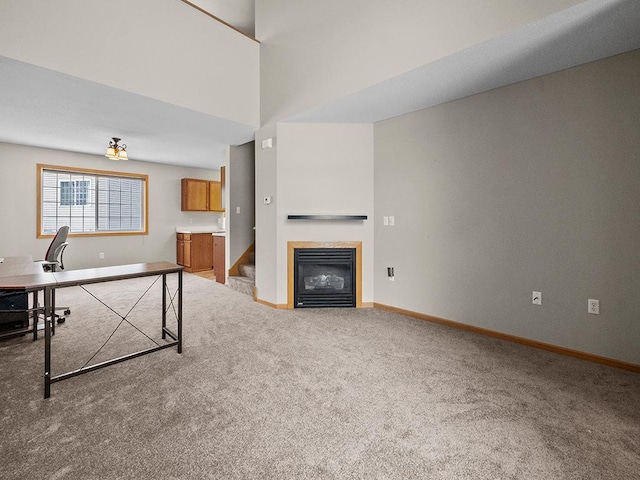 unfurnished living room featuring carpet floors